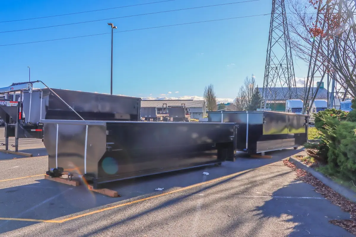 Roll-off dumpster ready for waste disposal at job site for Concrete Dumpster Rental in Wilbraham